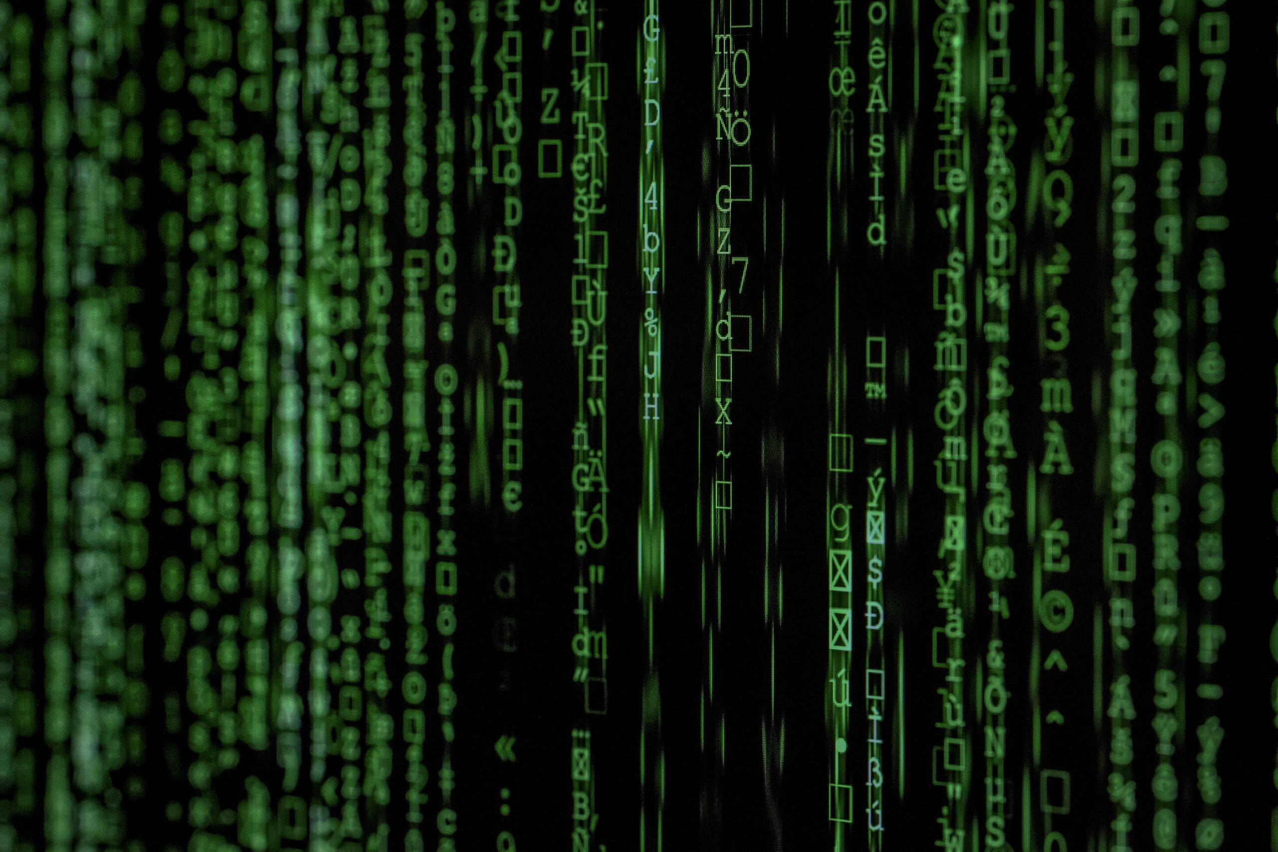 A close up of a green matrix code.